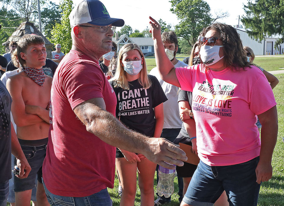 General News - 3rd place - A Black Lives Matter supporters (right) and a protesters argue during the BLM rally in St. Paris. (Bill Lackey / Springfield News-Sun)