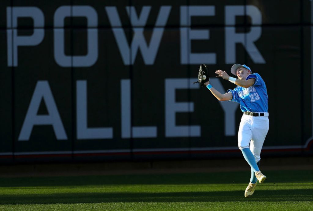 Sports - 3rd place - Alliance left fielder Christian Hall gets under a fly ball hit by Walsh's Bobby Perebzak during the second inning of a game at Canal Park in Akron. (Jeff Lange / Akron Beacon Journal)