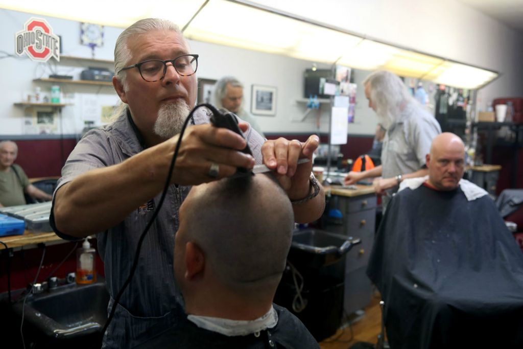 Feature - HM - Owner Tom Henry gives Mike Wander a haircut at Westerville Barber Shop. The shop turns 61 years old in August with Henry owning the shop since 2011. (Shane Flanigan / ThisWeek Community News)  