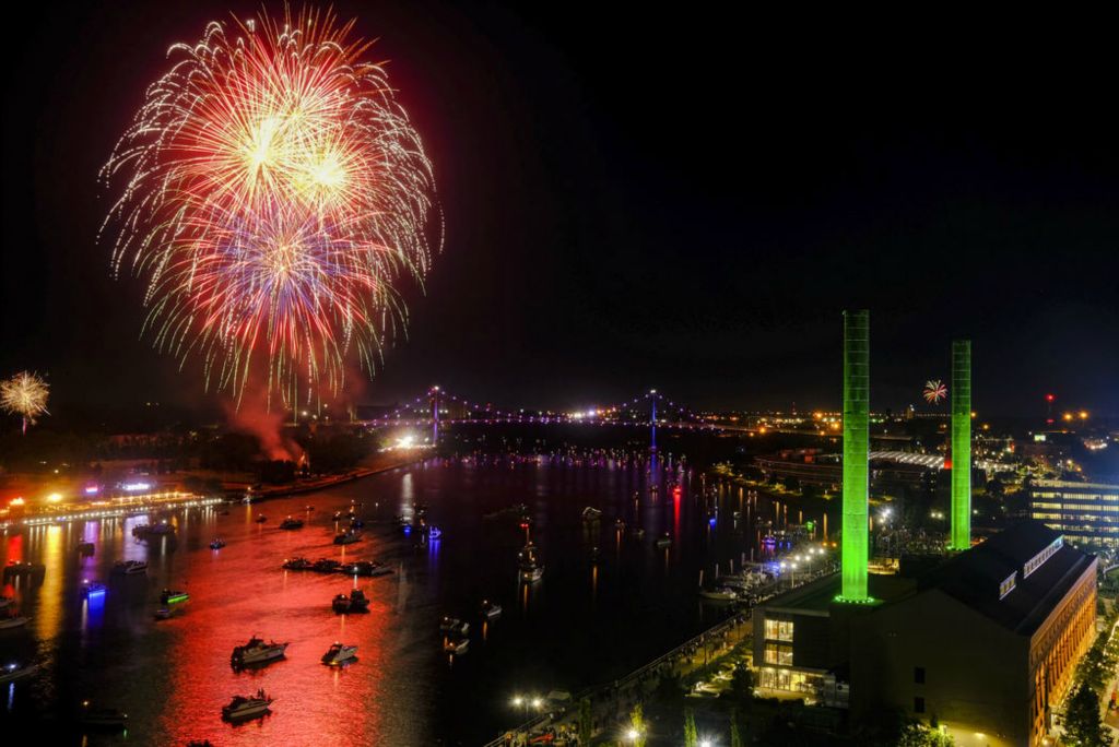 General News - 1st place - Independence Day fireworks go off over the Maumee River. Photo taken from The Heights restaurant on top of the Renaissance Hotel in Toledo.   (Jeremy Wadsworth / The Blade)  