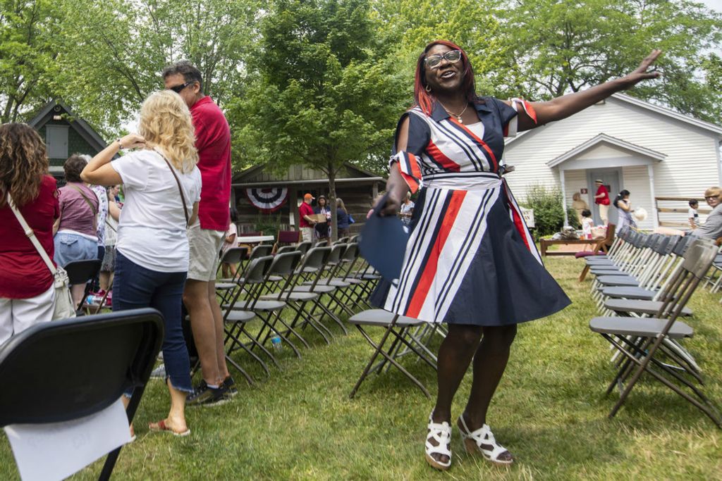 General News - 2nd place - Ingrid Ann Marie Peters dances after becoming an American citizen during the Naturalization Ceremony at Sauder Village in Archbold. (Rebecca Benson / The Blade)  