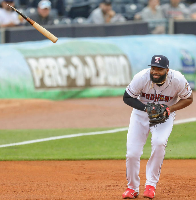 Sports - 1st place - Toledo’s Aderlin Rodriguez dodges the broken bat of Columbus’ Gabriel Arias as it flies by third base during a game at Fifth Third Field in Toledo. (Kurt Steiss / The Blade)  