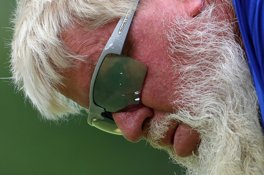 Sports - 1st place - John Daly watches his putt toward the fourth hole during the first round of the Kaulig Companies Championship pro-am at Firestone Country Club in Akron. (Jeff Lange / Akron Beacon Journal)