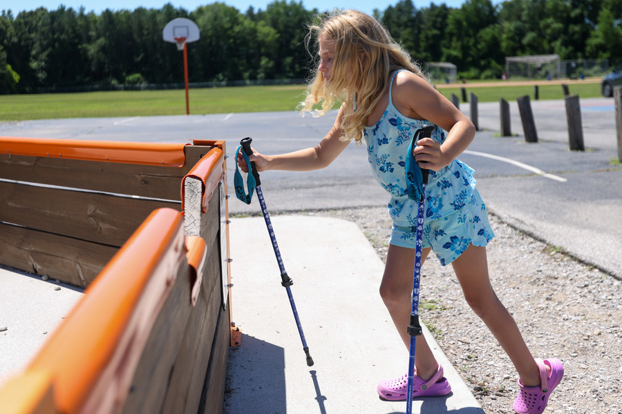 Story - HM - Eight-year-old Sparrow Brochu tries to get in a play structure at Stranahan Elementary School in Toledo, but is unable to due to the height of the entrance. (Jonathan Aguilar / The Blade)