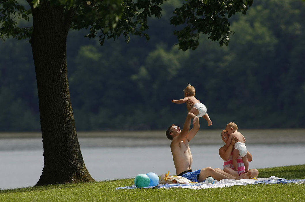 Feature - 1st place - Haley Griffis of Nashport and her boyfriend Evan Highfield of South Zanesville have their hands full with Haley's cousin's, twin one-year-old boys Ashton (left) and Aiden as they enjoy the sun at Dillon State Park. Haley will be babysitting the boys all summer before she and Evan head back as seniors to Mid-East Career & Technology Center where Haley will be studying early childhood development.  (Jonathan Quilter / The Columbus Dispatch)