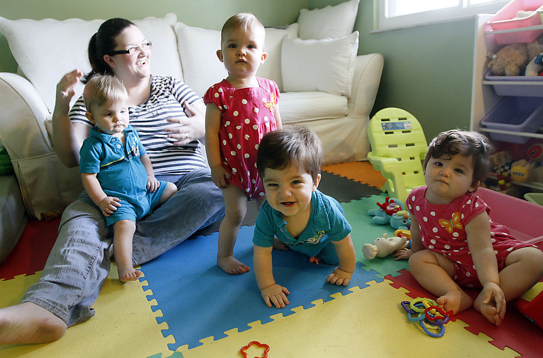 Portrait - 1st placeTanya Winebrenner sits with her children in her home. Her quadruplets , which just celebrated their first birthday, are doing well. They are Oliver, Keagan, Jack and Kirian. (Chris Parker / ThisWeek Newspapers)