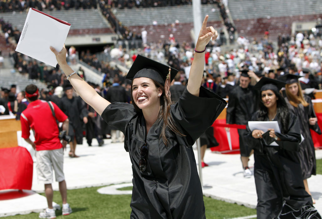 Story - 2nd placeErin Carey celebrates her marketing degree at the 400th commencement at Ohio State Stadium.  Ohio State will graduate the largest spring quarter class ever with the awarding of 10,642 degrees.  The ceremony is the university's 400th commencement and Ohio State‚Äôs last on the academic quarter system.  (Kyle Robertson / The Columbus Dispatch)