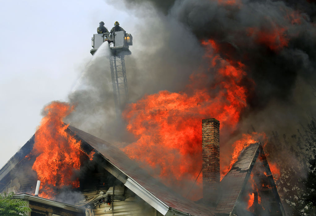 Spot News - 2nd placeToledo fire fighters battle a fire on Bancroft Street. (Andy Morrison / The Blade)