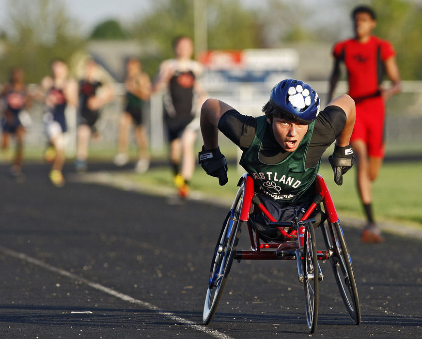 Story - 2nd placeTim Bailey races against other runners in a 800 meter race during a Tri meet at Grove City High School. (Kyle Robertson / The Columbus Dispatch)