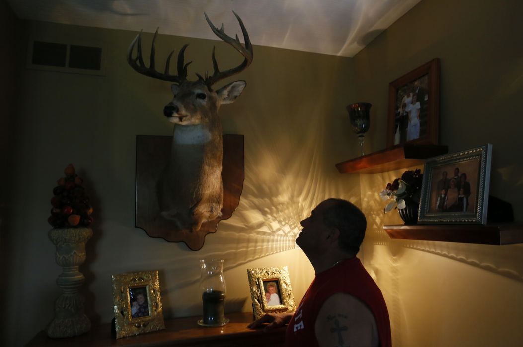 Story - 3rd placeMark Frederick, a former sniper in the armed services, has parlayed his passion for hunting and marksmanship into a business where he gets rid of nuisance animals such as groundhogs and coyotes. Mark has several trophy bucks mounted in his Powell home. (Eric Albrecht / The Columbus Dispatch)