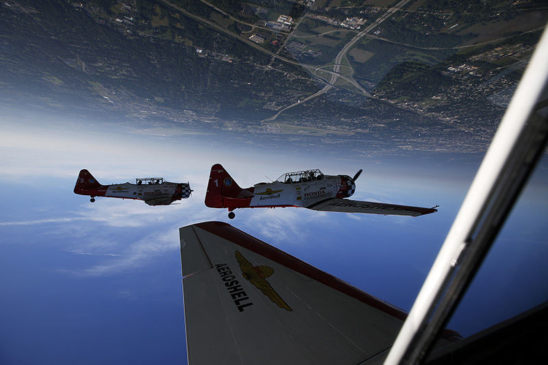 General News - 2nd place - As seen from Bryan Regan's plane, the AeroShell Aerobatic Team does a loop over Vandalia during a practice run and media ride in advance of the annual Dayton Air Show.  (Eamon Queeney / The Columbus Dispatch)