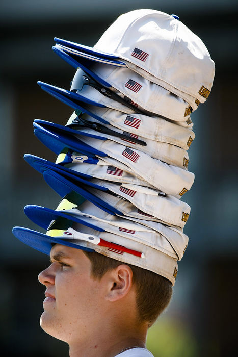 Sports Feature - 1st place - Gahanna Lincoln pitcher  Cole Gobson wears his teammates' ballcaps as the Lions try to rally from a three-run deficit during the last inning of Gahanna's Division I state semifinal game against North Royalton at Huntington Park in Columbus. Gahanna's rally fell short and they lost to North Royalton, 3-0. (Joshua A. Bickel / ThisWeek Community News)