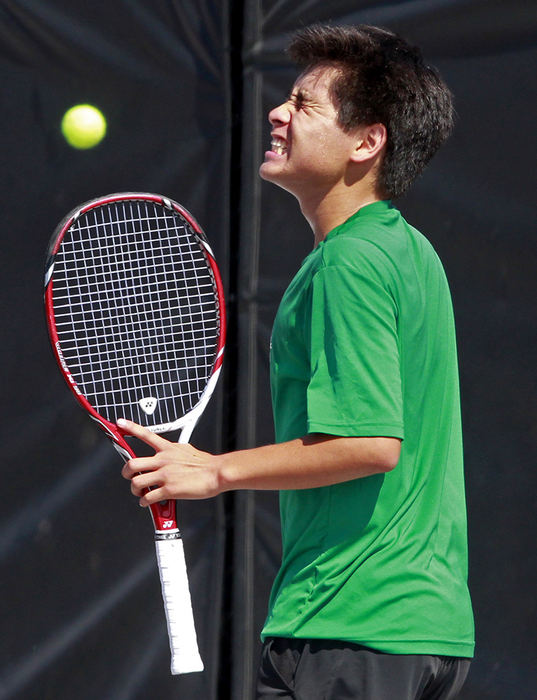 Sports Feature - 3rd place - Dublin Coffman's Bryan Yoshino reacts to a missed shot during his match against Massillon Jackson's Joey Thomas in round one of the state tennis tournament at Ohio State. (Lorrie Cecil / ThisWeek Community News)