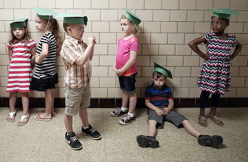 Feature - 1st place - Children from Miss Kathleen's class wait in line to enter the auditorium before the Safety Town graduation ceremony at Brinkerhoff School.   (Mitchell Pe Masilun / The (Mansfield) News Journal)