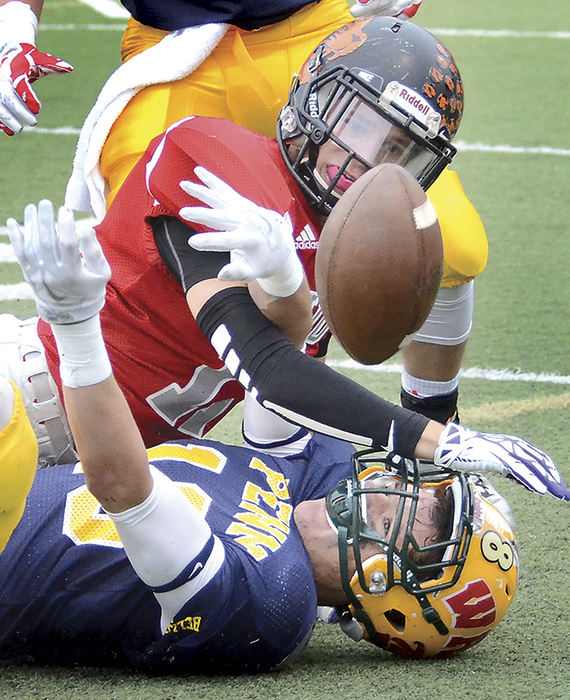 Sports - 2nd place - Springfield’s Ryan Kohler (left) and Blackhawk’s Tim Mancini go after a pass at the Penn-Ohio Stateline Classic at Geneva College's Reeves Field. Pennsylvania won 34-20 to take a 26-10 lead in the series. (Patricia Schaeffer / The (Lisbon) Morning Journal)