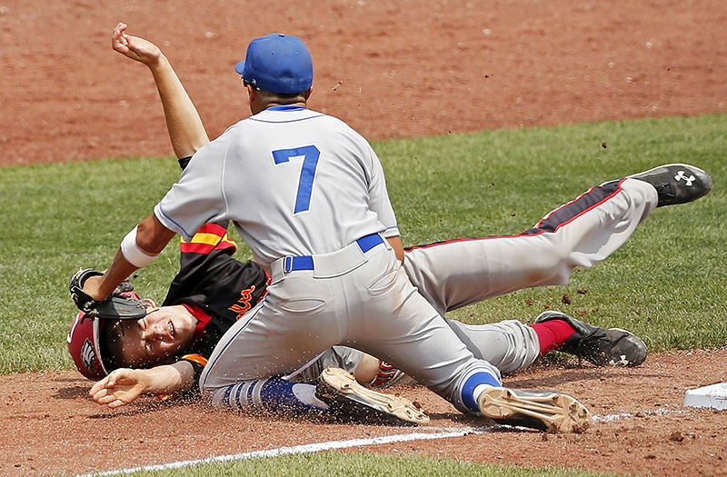 Sports - HM - Connor Gerren (35) of Sunbury Big Walnut is tagged out at third base by Garrett Sierra (7) of Defiance in their Division II state semifinal baseball game at Huntington Park in Columbus. Defiance won the game 8-1.  (Barbara J. Perenic / The Columbus Dispatch)