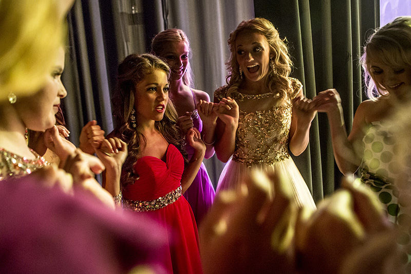 Story - 2nd place - Backstage, moments before the girls go onstage to compete for the Miss Ohio Outstanding Teen title, they stand in a circle holding their pinkies fingers together saying good luck to one another. (Jessica Phelps / Newark Advocate)