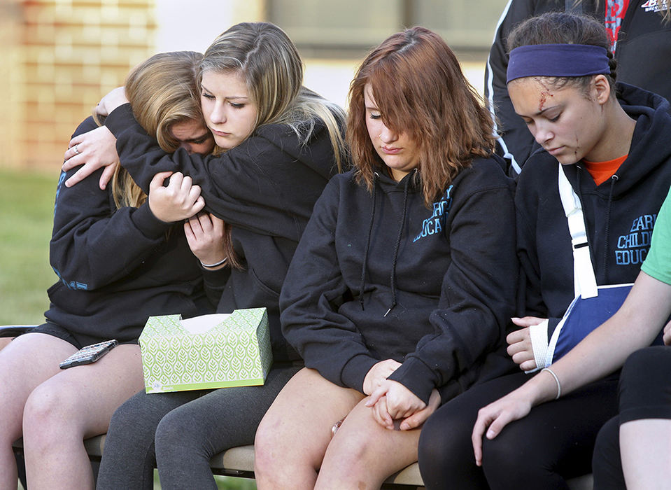 General News - 2nd place - Teens console each other  during a service for Brianna Yarger, who lost her life in a car crash. Destany Taylor, far right, survived the crash. (Scott Heckel / The (Canton) Repository)