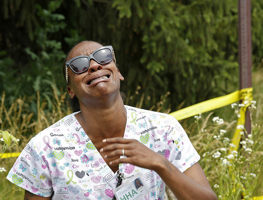 Spot News - 3rd place - People react at the scene of a fatal shooting in the 4100 block of Larry Place, a cul-de-sac south of E. Livingston Avenue. Columbus Police are investigating the shooting as a homicide.  (Barbara J. Perenic / Barbara J. Perenic)