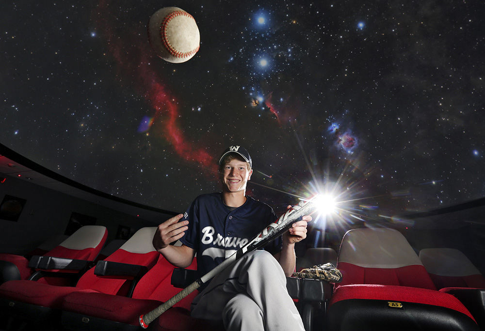 Portrait - 1st place - Michael Ray of Whetstone High School scholar athlete who hopes to study astronomy in the future inside the planetarium at OSU. (Eric Albrecht / The Columbus Dispatch)