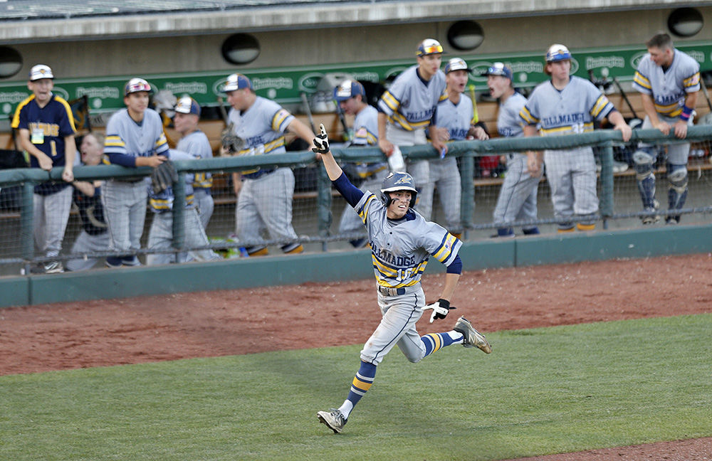 Sports Feature - 2nd place - Jared Burick (10) of Tallmadge reacts on his way to scoring a run, one of three in the third inning scored by the Blue Devils, during a Division II state semi-final game against Maumee at Huntington Park in Columbus. (Barbara J. Perenic / The Columbus Dispatch)