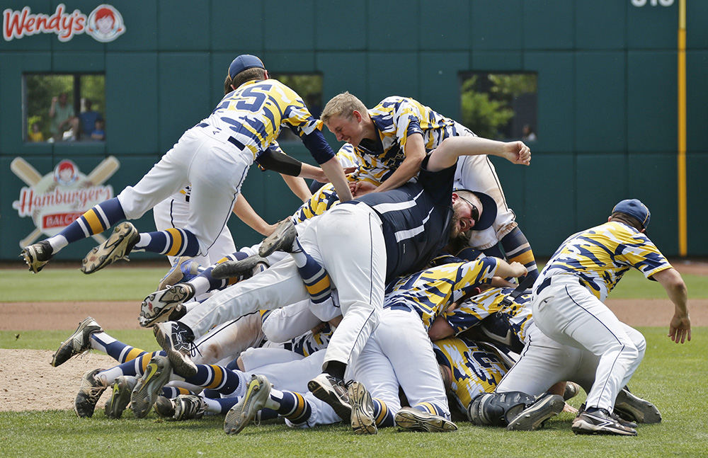 Sports Feature - 3rd place - Tallmadge players pile on the pitchers mound while celebrating a 4-0 win over Chaminade-Julienne in the Division II state championship game at Huntington Park in Columbus. (Barbara J. Perenic / The Columbus Dispatch)