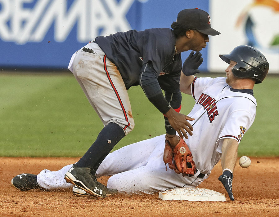    Sports - 1st place - Toledo Mud Hens first baseman John Hicks slides safely into second base as Gwinnett Braves second baseman Ozzie Albies looses the ball during the third inning of a game at Fifth tHird Field in Toledo.   (Jeremy Wadsworth / The Blade)