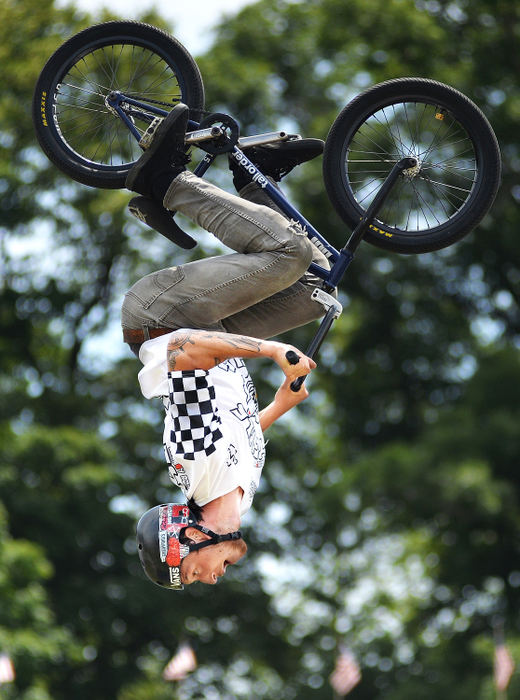 Feature - HMVinnie Devera flips as he performs in Johnny Rockett's Cycle Circus Live! at the Maria Stein Country Fest. (Daniel Melograna/The Daily Standard)