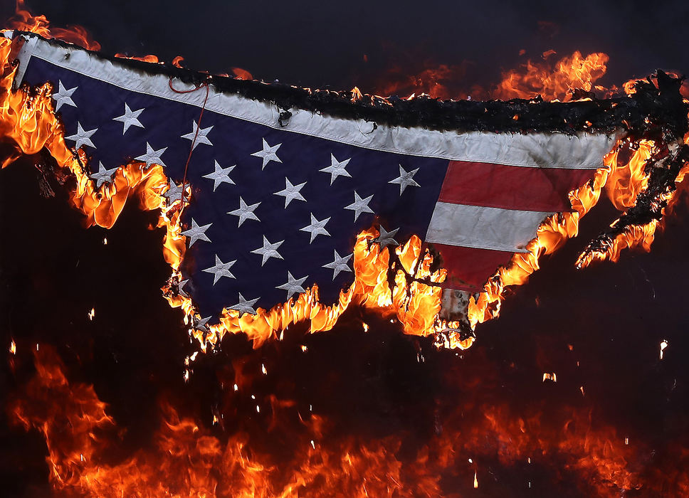 General News - 3rd placeThousands of American flags are burned during the annual Flag Day flag retirement ceremony at American Legion Post 286 in New Carlisle. (Bill Lackey/Springfield News-Sun)