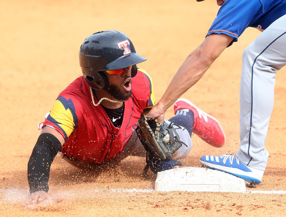 Sports - 3rd placeToledo Mud Hens' Willi Castro slides safely into third base against the Durham Bulls in the bottom of the fourth inning at Fifth Third Field in Toledo. (Amy E. Voigt/The Blade)