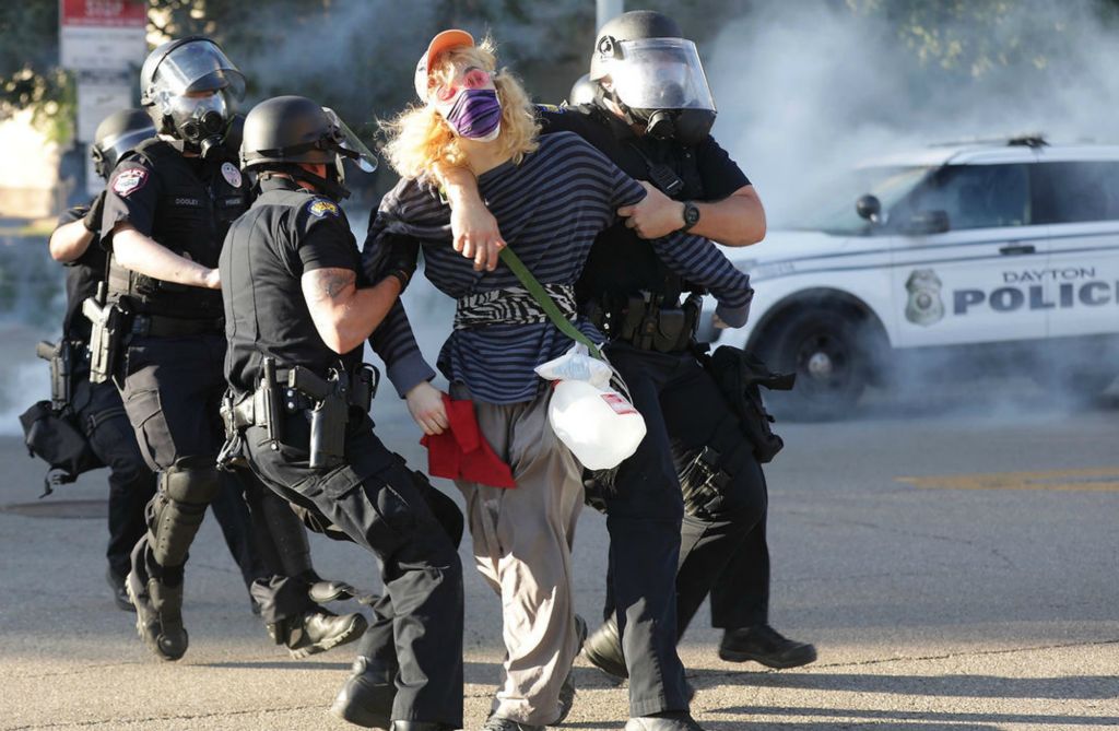 General News - HM - A protester is tackled by police after he threw a bottle at them as protesters and police clash during the protests in Dayton following the George Floyd murder.  (Bill Lackey / Springfield News-Sun)