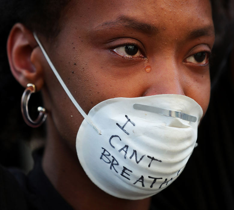 Portrait - 1st place - Lydia Rogers of Akron sheds a tear as she protests against police brutality in front of Harold K. Stubbs Justice Center. (Jeff Lange / Akron Beacon Journal)