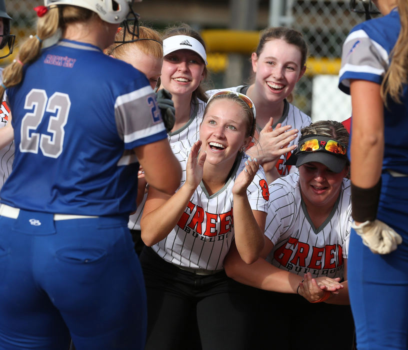 Sports Feature - 1st place - Lake's Emily Lippe (23) is welcomed home after her home run during the fourth inning of the Federal League All-Star Softball Game at Willig Field. (Scott Heckel / The Canton Repository)