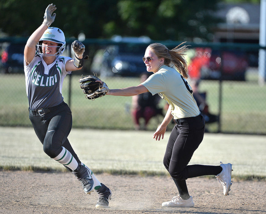 Sports - 1st place - Celina’s Karissa Frederick (3) attempts to avoid the tag out by Parkway’s Gracyn Temple (6) in the fourth inning at Westview Park in Celina. (Daniel Melograna / The Daily Standard)