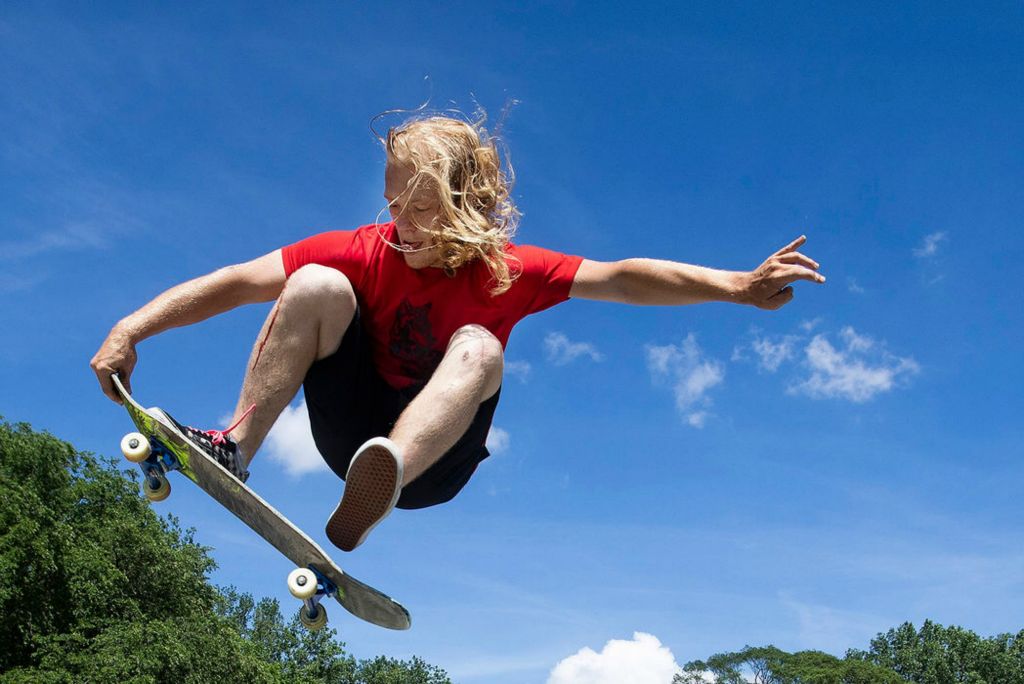 Sports - 2nd place - Tucker Connelly jumps over a barrel at Highland Park Skate Park in Toledo. (Rebecca Benson / The Blade)