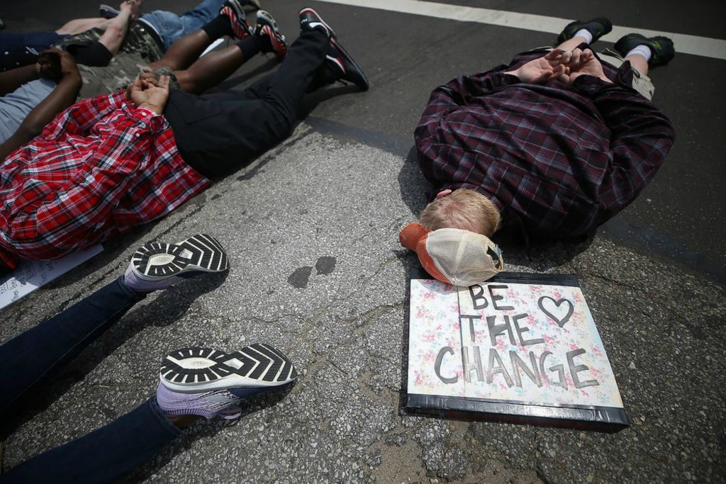 Story - 3rd place - Protesters lay down in the intersection of North Main Street and East Tallmadge Avenue in honor of George Floyd during a march against police brutality in Akron. (Jeff Lange / Akron Beacon Journal)