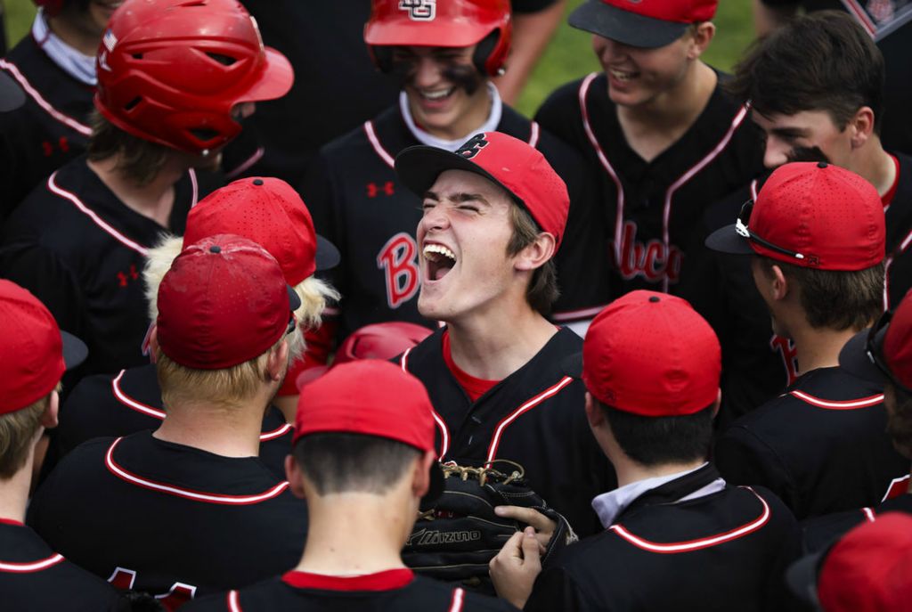 Sports Feature - 1st place - Bowling Green’s Michael Becker (center) cheers with his teammates before the Division I baseball regional semifinal against St. John’s at BGSU’s Warren Steller Field. (Rebecca Benson / The Blade)