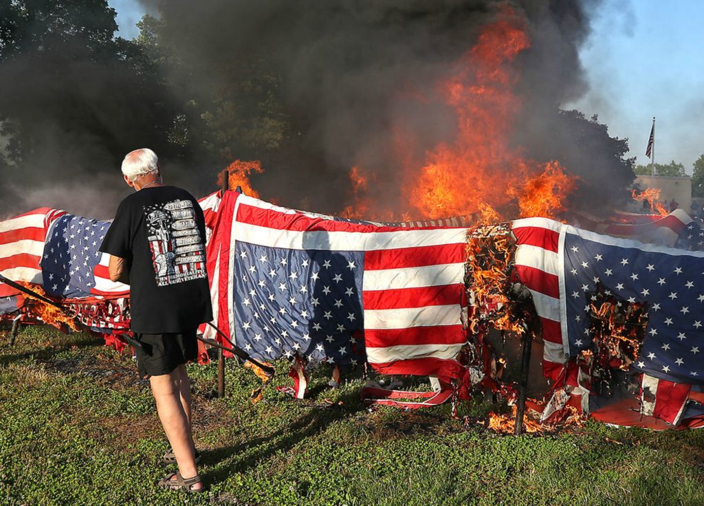 General News - HM - In honor of Flag Day, American Legion Post 286 held their annual flag retirement ceremony, June 14, 2022 in New Carlisle. This year Post 286 burned over 10,000 worn out and faded American flags.  (Bill Lackey / Springfield News-Sun)