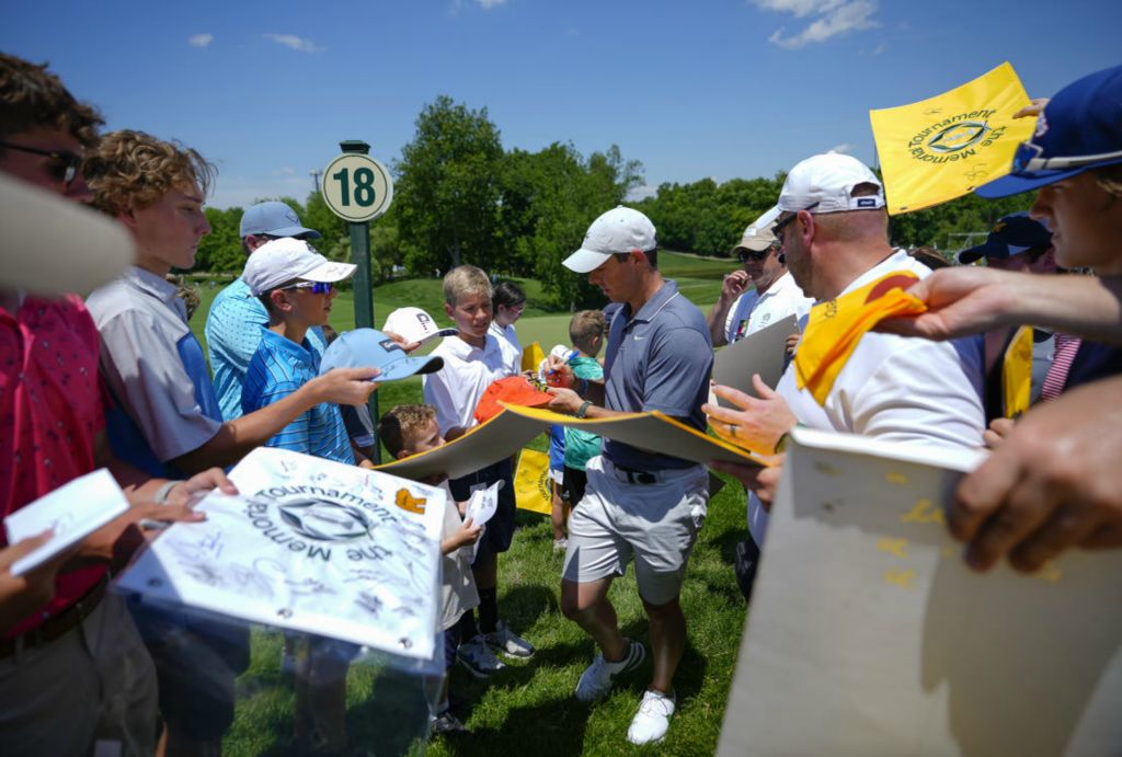 Story - 1st place - Many of the best golfers in the world descend on Dublin, Ohio every year to make the week-long Memorial Tournament, held at Jack Nicklaus' Muirfield Village Golf Club, a fan favorite on the PGA tour. Billy Horschel won the event. Rory McIlroy signs autographs as the leaves the 18th green following a practice round at the tournament on May 31, 2022.  (Adam Cairns / The Columbus Dispatch)