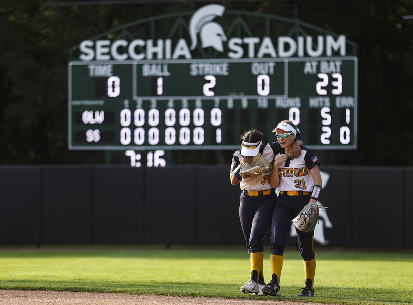 Sports Feature - 2nd place - Whiteford’s Patrina Marsh and Jillian Webb walk back to the dugout after Standish-Sterling’s walk-off win in the D-3 MHSAA state championship softball game at MSU’s Secchia Stadium in East Lansing. Whiteford fell to Standish-Sterling, 1-0.  (Rebecca Benson / The Blade)