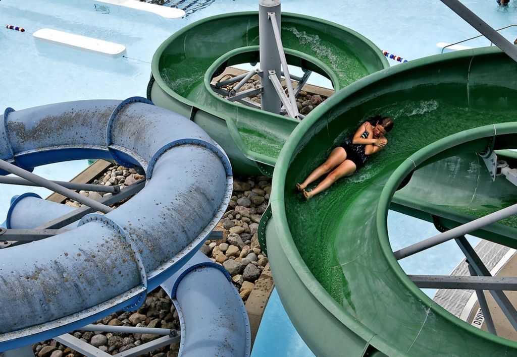 Feature - 3rd place - A swimmer slides down one of the twisty water slides at Splash Zone water park.  (Bill Lackey / Springfield News-Sun)