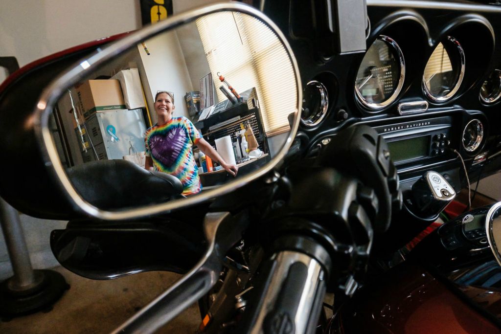 Portrait - 2nd place - Kyra Cunningham, daughter of Steve and Sandy, is seen reflected in her father's motorcycle from the Cunningham's home in Dundee. The couple recently passed away within a day of one another. Kyra has just begun the complicated process of assessing her parent’s possessions. (Andrew Dolph / The Times Reporter)