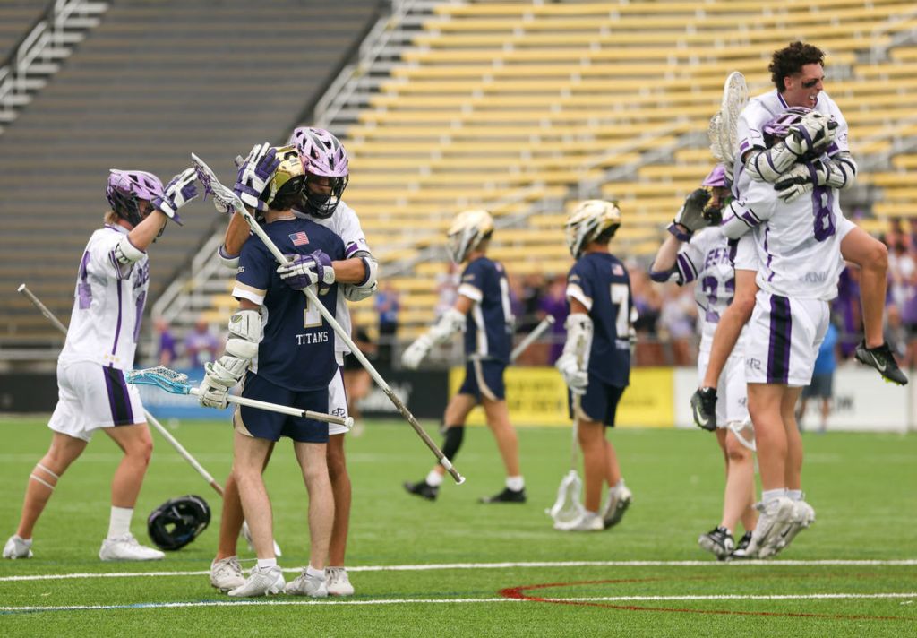 Sports Feature - 1st place - St. John’s Quinn Wiklendt (1) and St. Francis’ John Kraker hug at the conclusion of the Division II high school boys lacrosse state title game between St. John’s Jesuit and Columbus St. Francis DeSales at Crew Stadium in Columbus. (Kurt Steiss / The Blade)