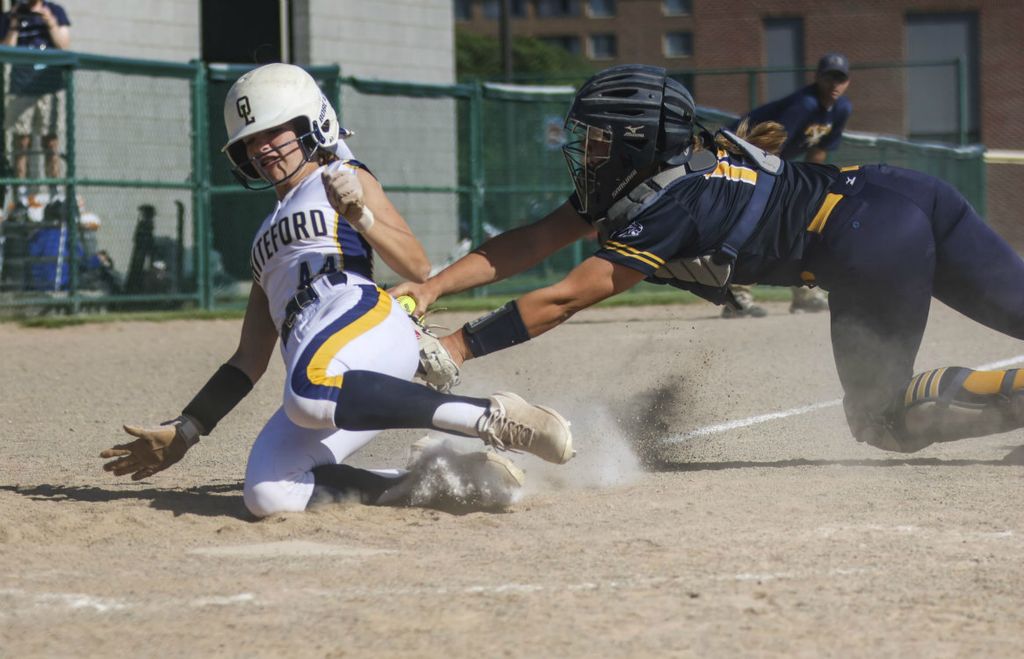 Sports - 2nd place - Whiteford’s Koralynn Billau gets tagged out by Algonac’s Ava Murray during the state quarterfinal game at Wayne State in Detroit, Michigan. Whiteford defeated Algonac, 2-0.  (Rebecca Benson / The Blade)