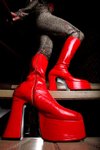 Illustration - 2nd place - Rich Kline sports glam rock boots reminiscent  David Bowie's Ziggy Stardust days at the Beck Center for the Arts in Lakewood. Kline dresses in many of Bowie's incarnations during his live shows in his Bowie tribute band called Diamond Dogs.  (Lisa DeJong / The Plain Dealer)