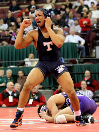 Sports - 2nd place - An emotional Michael Baker of Twinsburg celebrates after defeating Cincinnati Elder's Ian Korb for the state wrestling championship in the 171-pound match in Columbus. (Marvin Fong / The Plain Dealer)