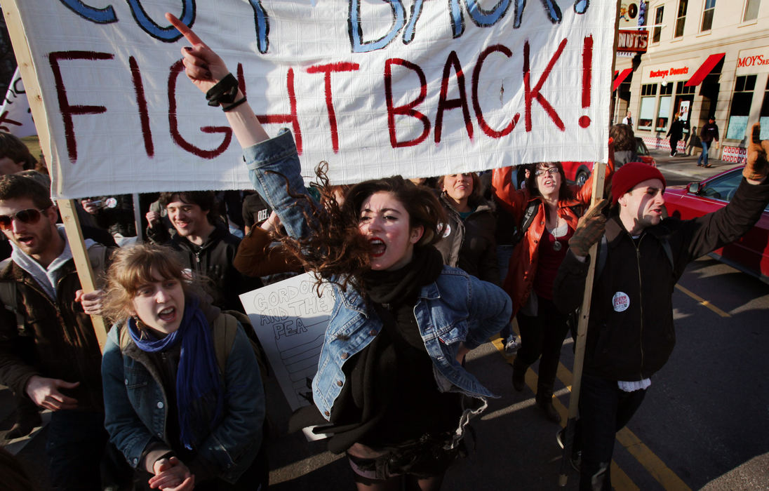 General News - 1st placeNatalia Lepore Hagan, an OSU student, marches down High St. after a rally on the oval. Students were protesting the increasing costs at the university. (Eric Albrecht / The Columbus Dispatch)