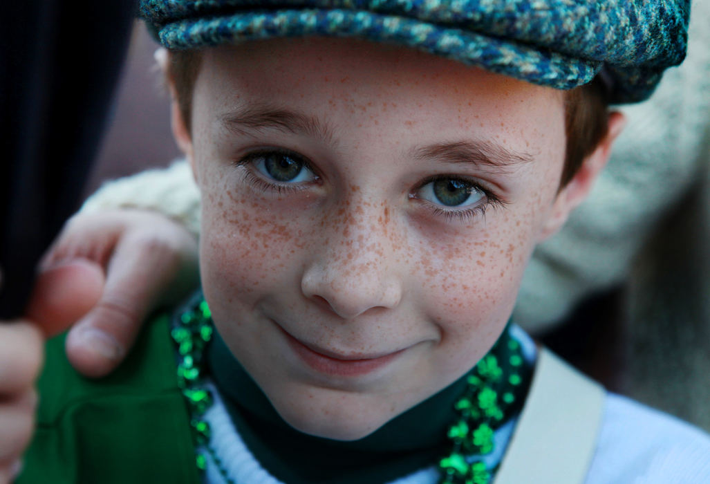 Story - 2nd placeKeevan Sullivan 11 of Galloway who carried one of the county flags of Ireland in parade waits for the march to get underway . (Eric Albrecht / The Columbus Dispatch)