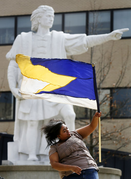 Feature - 1st placeJulia Walker, of Columbus, twirls her flag on the campus of Columbus State Community College. Julia who was a member of the Olentangy High School color guard when in high school she says she find practice to be a great stress reliever.   (Eric Albrecht / The Columbus Dispatch)