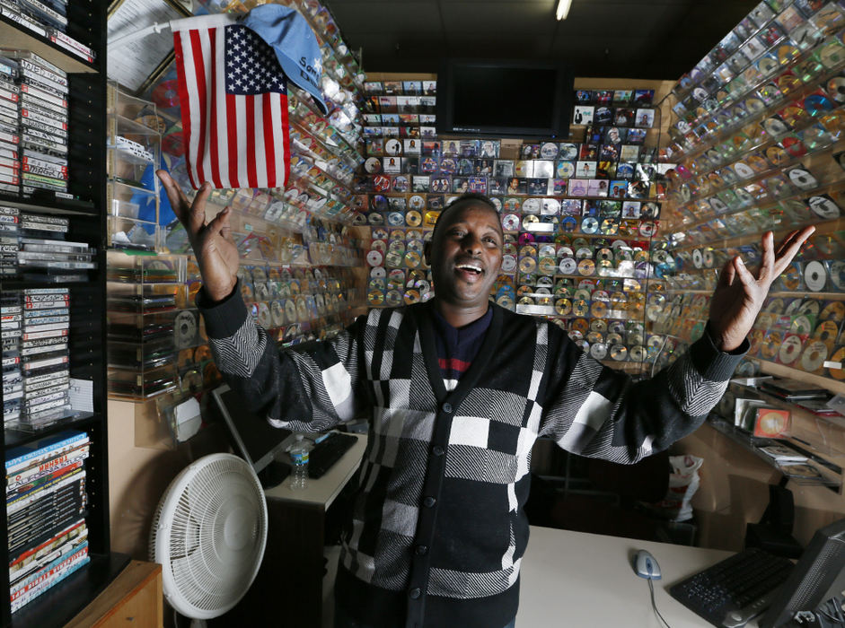 Portrait - 2nd placeAbdinur Daljir at his shop at the Global Mall in Columbus. He was part of the Somalian music group that was popular in the 1980's. A German label has re-relaesed one of their albums and its gaining a following.  (Eric Albrecht / The Columbus Dispatch)